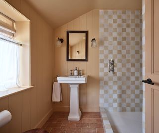 bathroom with peach, white and terracotta colour palette