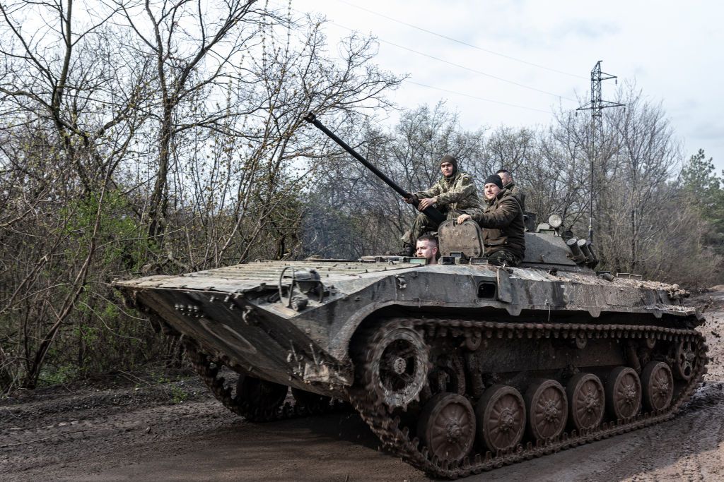 Ukrainian soldiers driving a tank. 