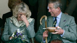 Camilla and Charles laughing together.