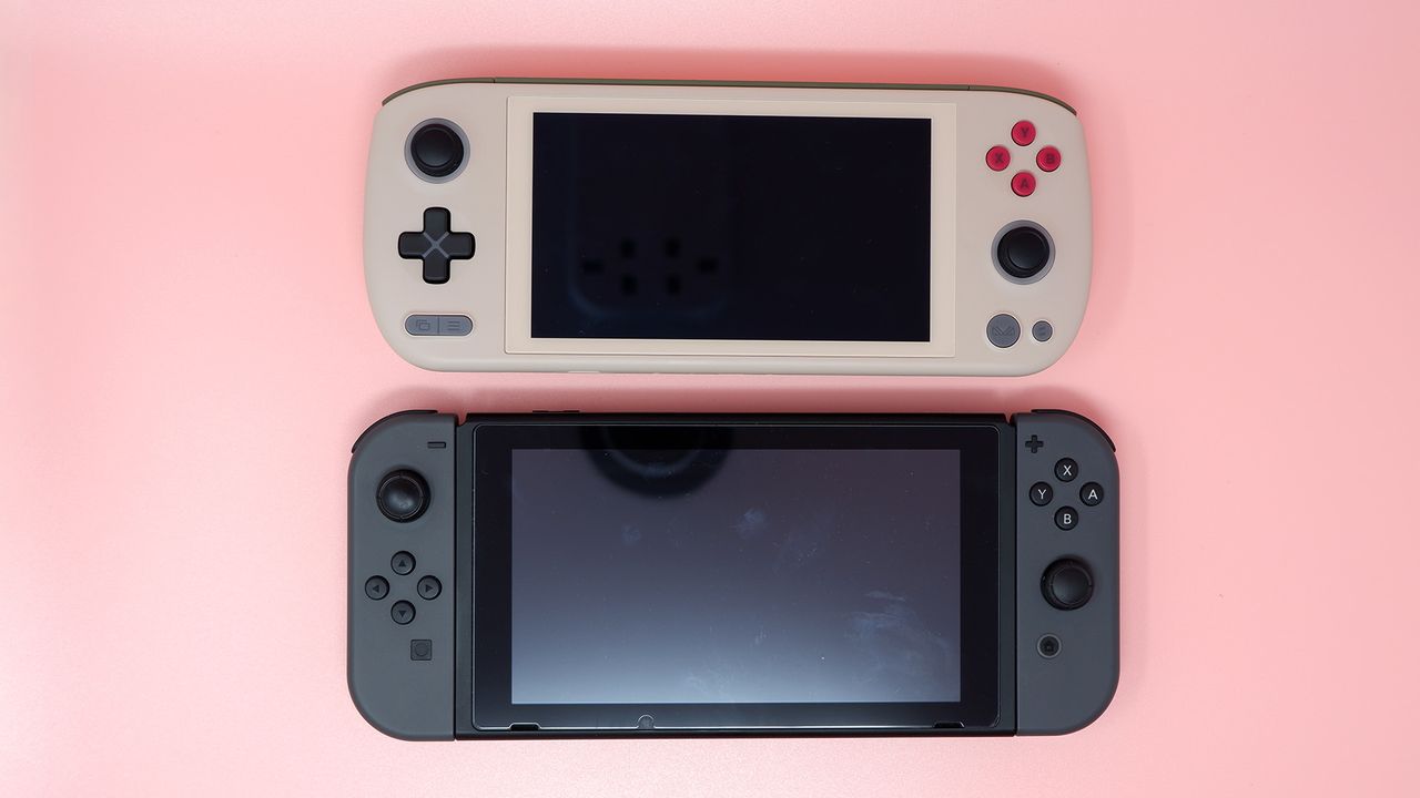 Ayaneo Air 1S handheld gaming PC on a pink background.