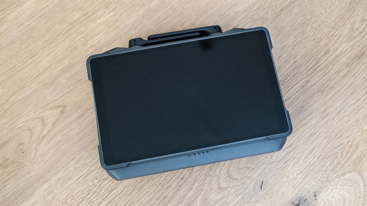DJI Mavic 4 Pro DJI RC 2 smart controller switched off and folded on a wooden floor