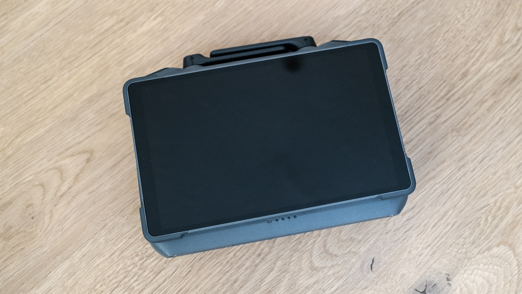 DJI Mavic 4 Pro DJI RC 2 smart controller switched off and folded on a wooden floor
