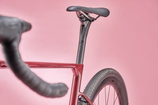 Vitus Venon Evo Force AXS gravel bike on a pink background