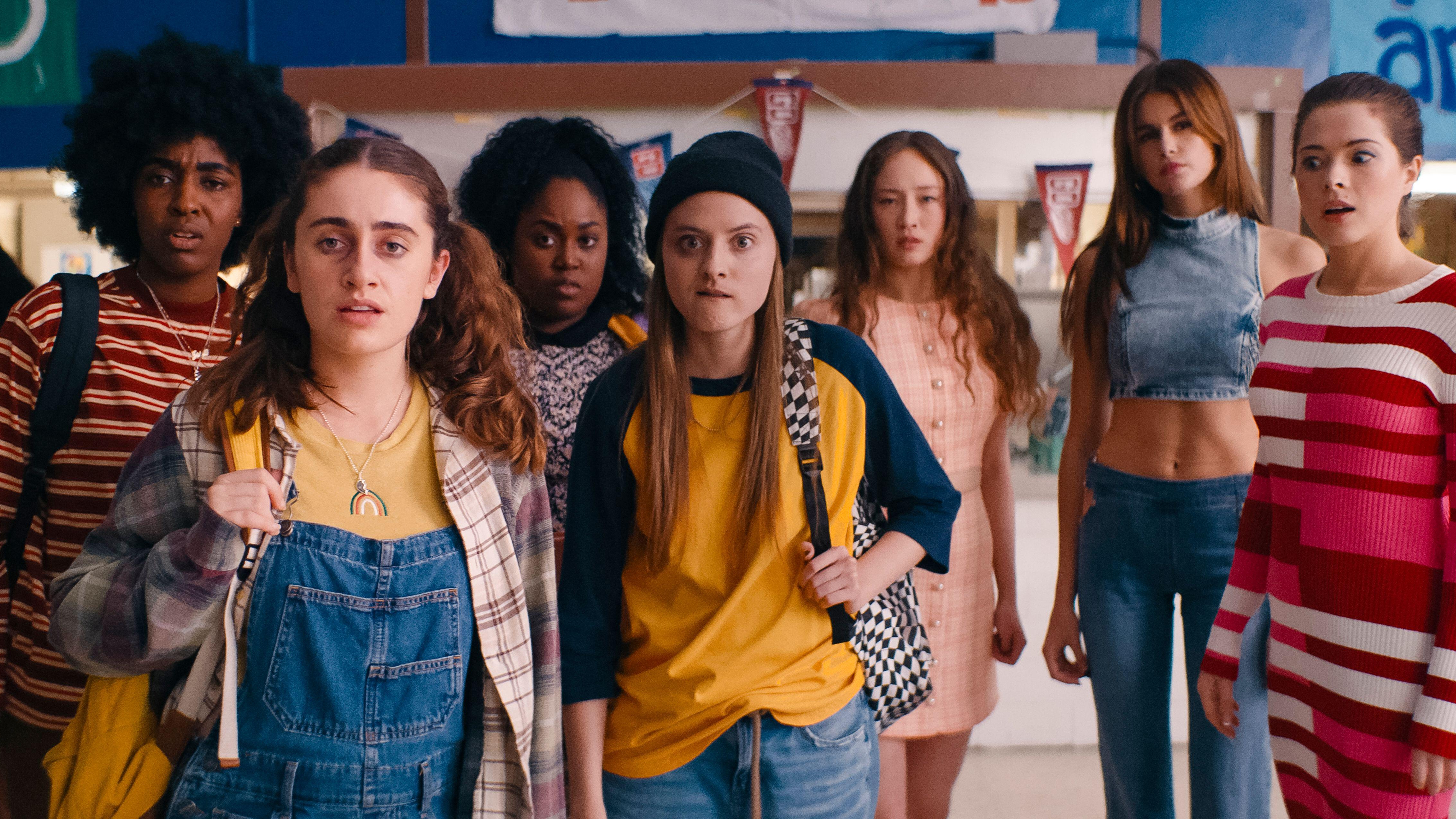 The "Bottoms" cast walk through a cafeteria in a scene from the 2023 comedy