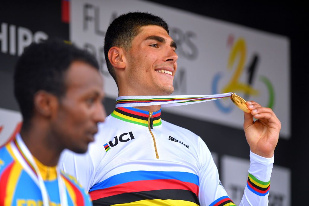 LEUVEN BELGIUM SEPTEMBER 24 Silver medalist Biniam Girmay of Eritrea gold medalist Filippo Baroncini of Italy and bronze medalist Olav Kooij of The Netherlands pose on the podium during the medal ceremony after the 94th UCI Road World Championships 2021 Men U23 Road Race a 1609km race from Antwerp to Leuven flanders2021 on September 24 2021 in Leuven Belgium Photo by Luc ClaessenGetty Images
