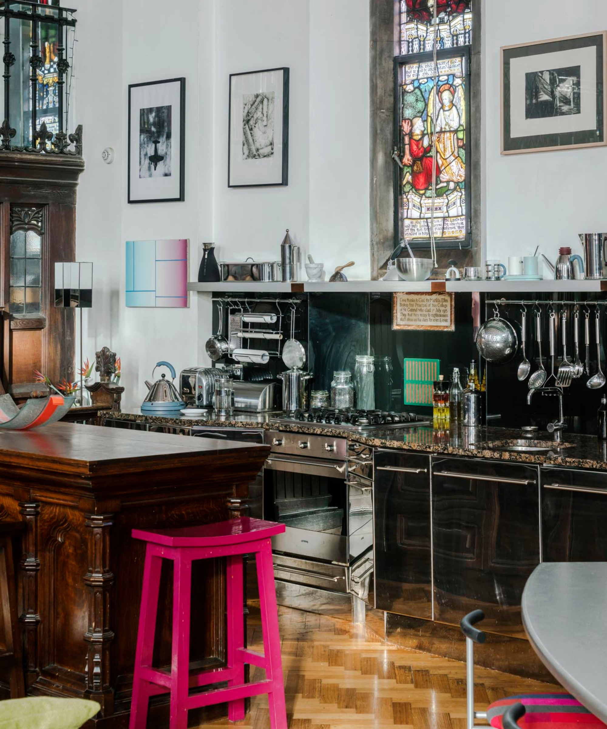 kitchen in church with wooden cabinetry and stainless steel features