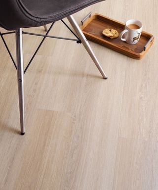 Oak effect luxury vinyl tile under chair