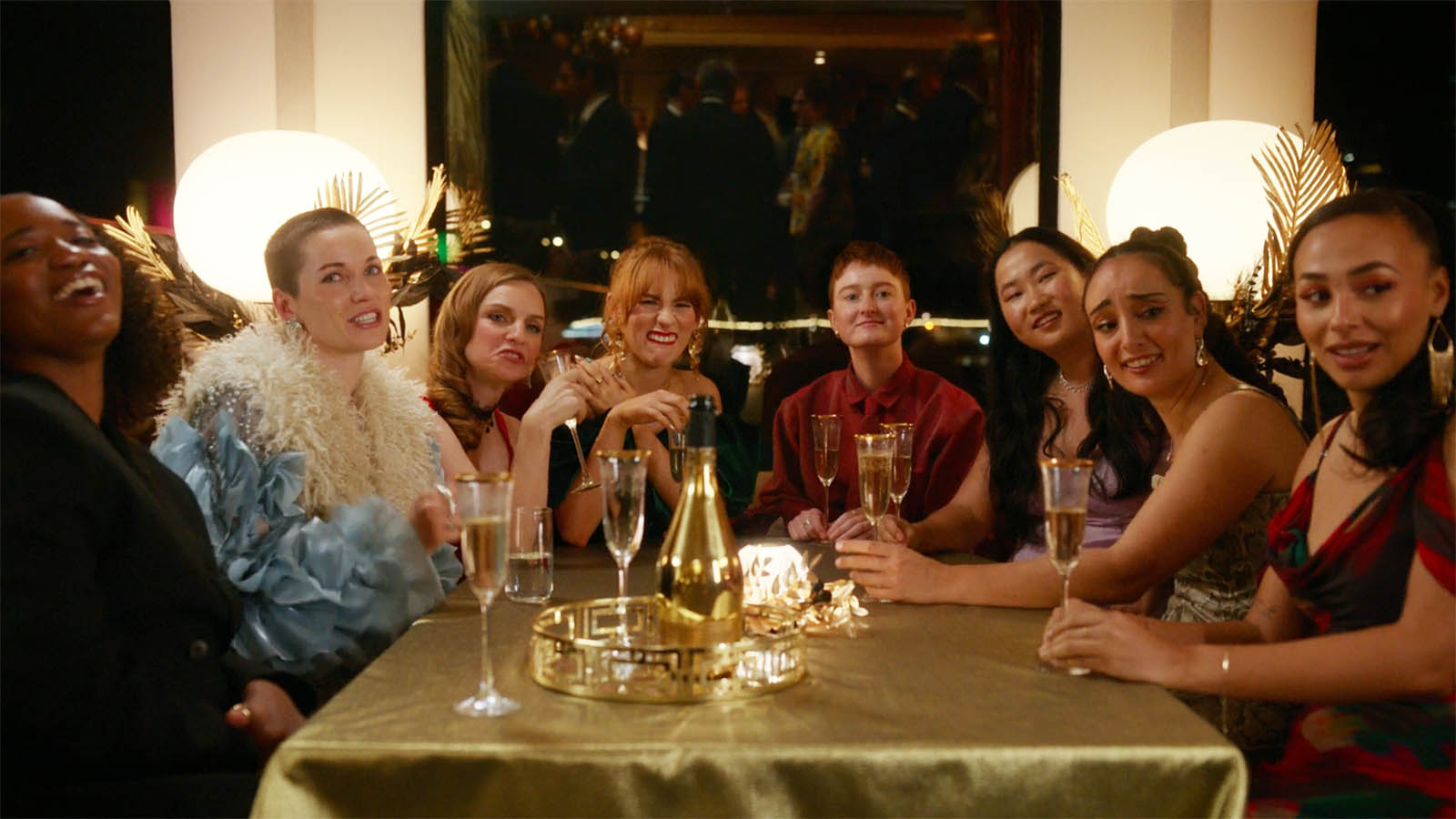 AFC Richmond Women's team sitting down at a table while dressed up in Ted Lasso season 4 episode 6