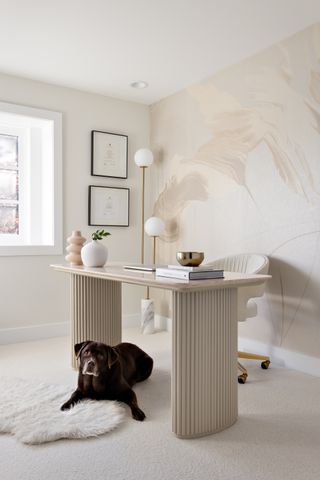 A home office with metallic wall covering