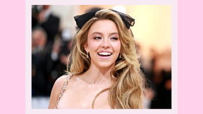 Sydney Sweeney wears a black bow and pink dress attends The 2023 Met Gala Celebrating "Karl Lagerfeld: A Line Of Beauty" at The Metropolitan Museum of Art on May 01, 2023 in New York City. / in a pink template