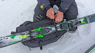 Fastening skis to the Db Fjäll 34L Backpack