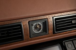 The original clock survives, surrounded by uprated wooden veneers