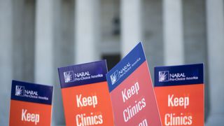 "Keep Clinics Open" protest signs
