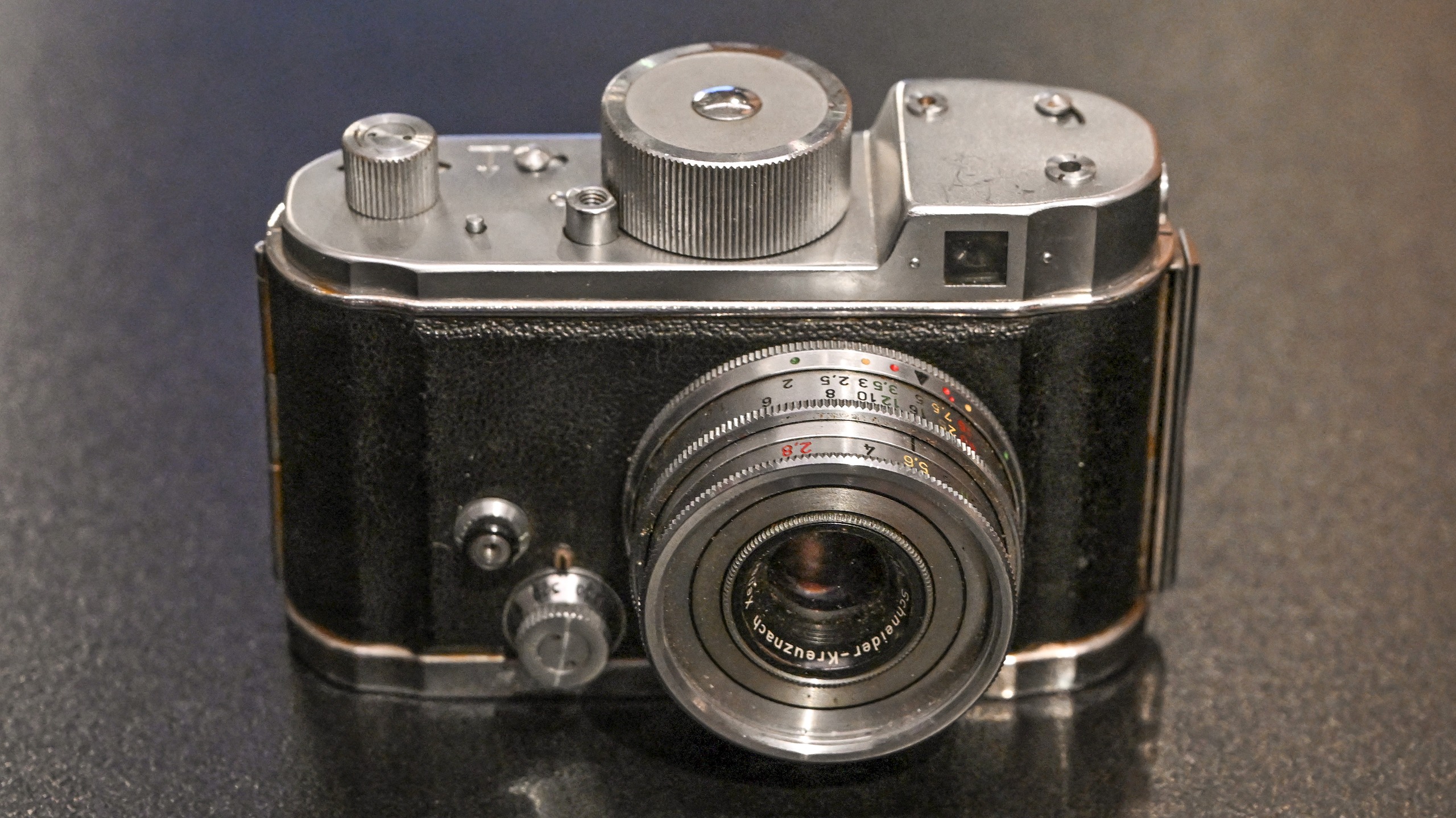 A photograph taken on April 3, 2025 shows a Robot Star 50 miniature concealment camera, from around 1970, displayed at the "MI5: Official Secrets" exhibition at the National Archives in west London