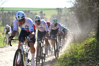 Slovakian champion Lukáš Kubiš leads a group of riders over the cobbles at the GP de Denain