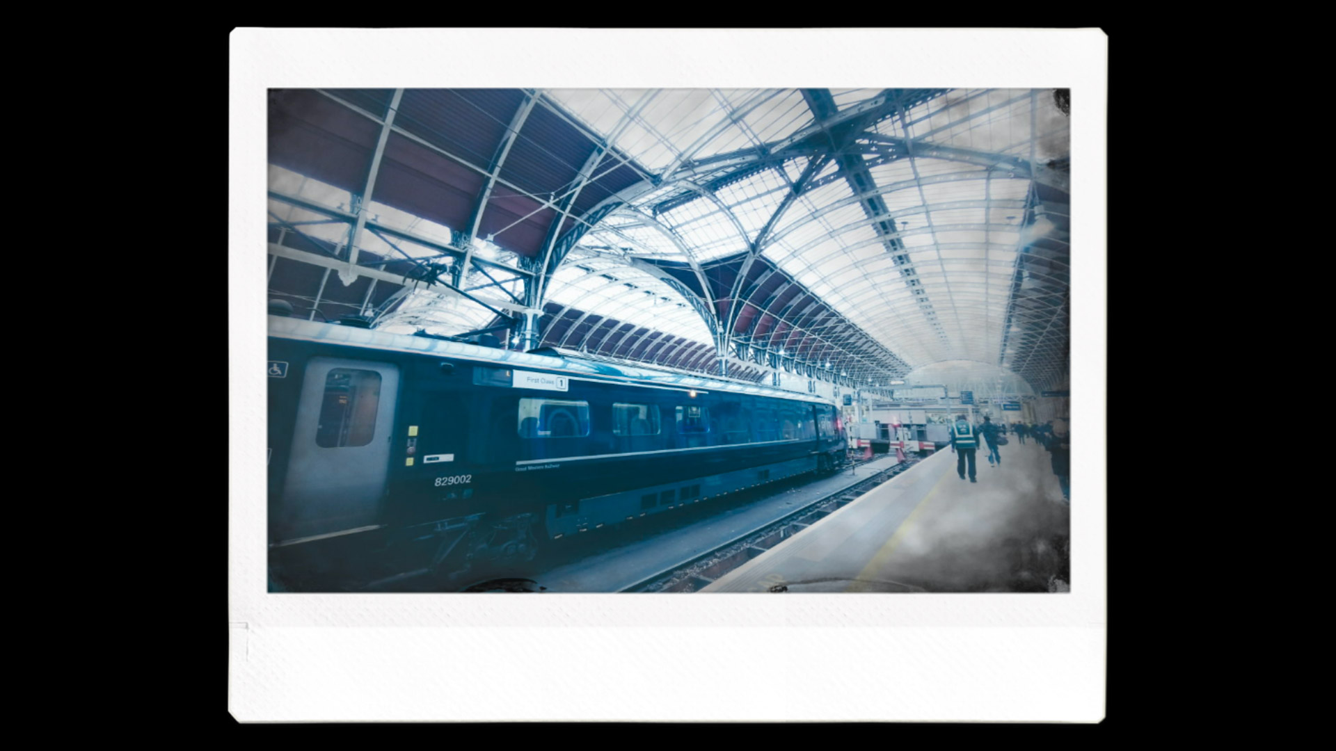 An Instax image printout of a train with a grainy film effect 