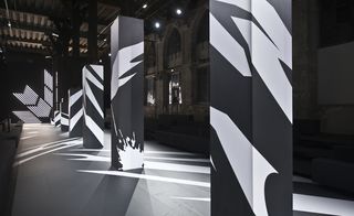 black and white graphic elements, with matching neon tube lighting, referencing the stripes of the Adidas logo