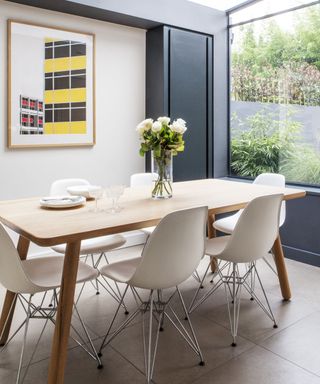 modern dining room in glass rear extension with window to garden
