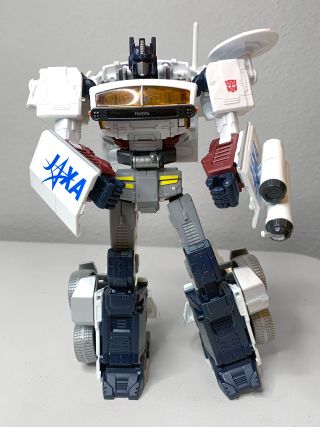 closeup of a transformer toy standing on a grayish-white table