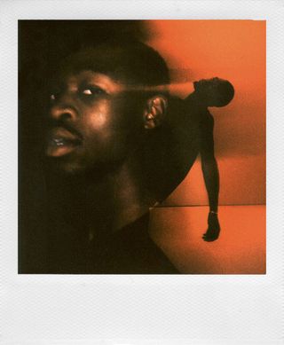 Polaroid double exposure photo of man's silhouette and face