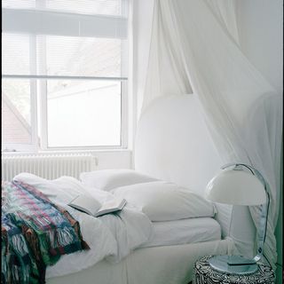 bedroom with white walls and bed