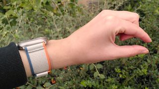 Woman's hand using double-tap gesture for Apple Watch Ultra 2