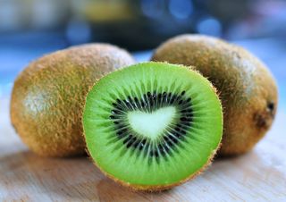 kiwi cut in half looking at the centre of the fruit