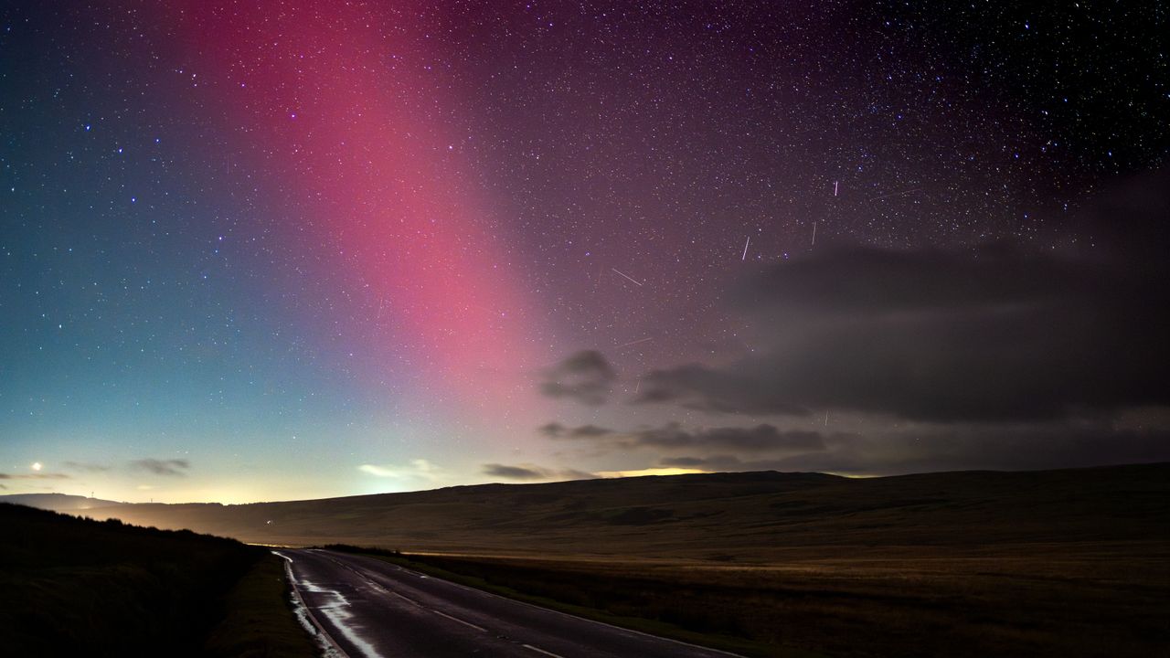 aurora borealis over a road