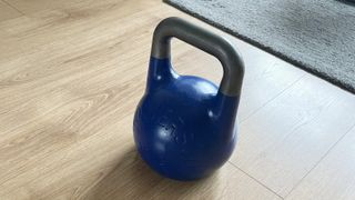 Wolverston competition kettlebell in blue on wooden floor during best kettlebells testing