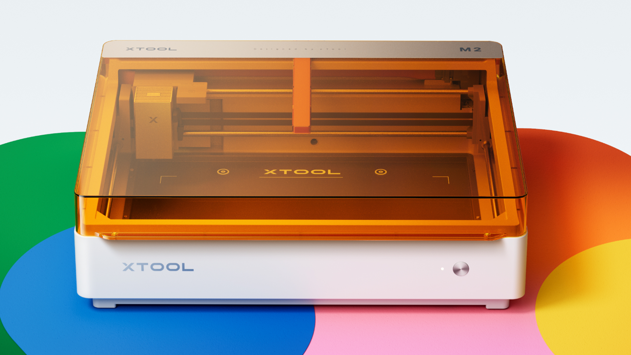 xTool M2 craft printer on a colorful surface