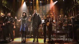 Arcade Fire performing on SNL