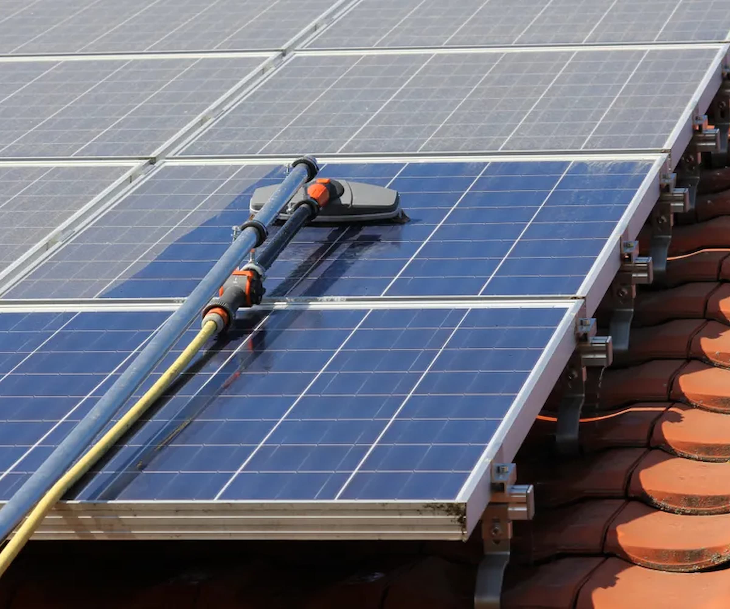 Cleaning solar panels of dust using long cleaner