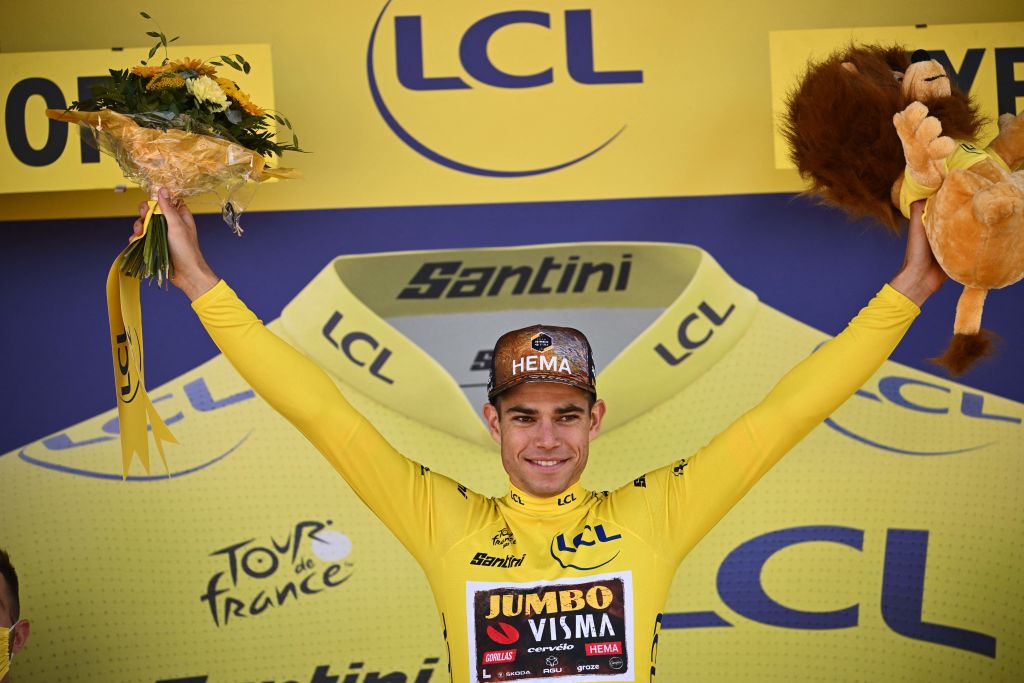 JumboVisma teams Belgian rider Wout Van Aert celebrates with the overall leaders yellow jersey on the podium after the 2nd stage of the 109th edition of the Tour de France cycling race 2022 km between Roskilde and Nyborg in Denmark on July 2 2022 Photo by Marco BERTORELLO AFP Photo by MARCO BERTORELLOAFP via Getty Images