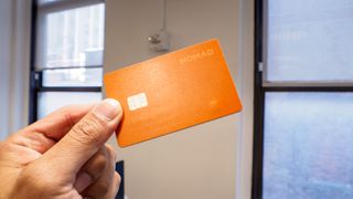 Nomad Tracking Card Pro held in the hand.