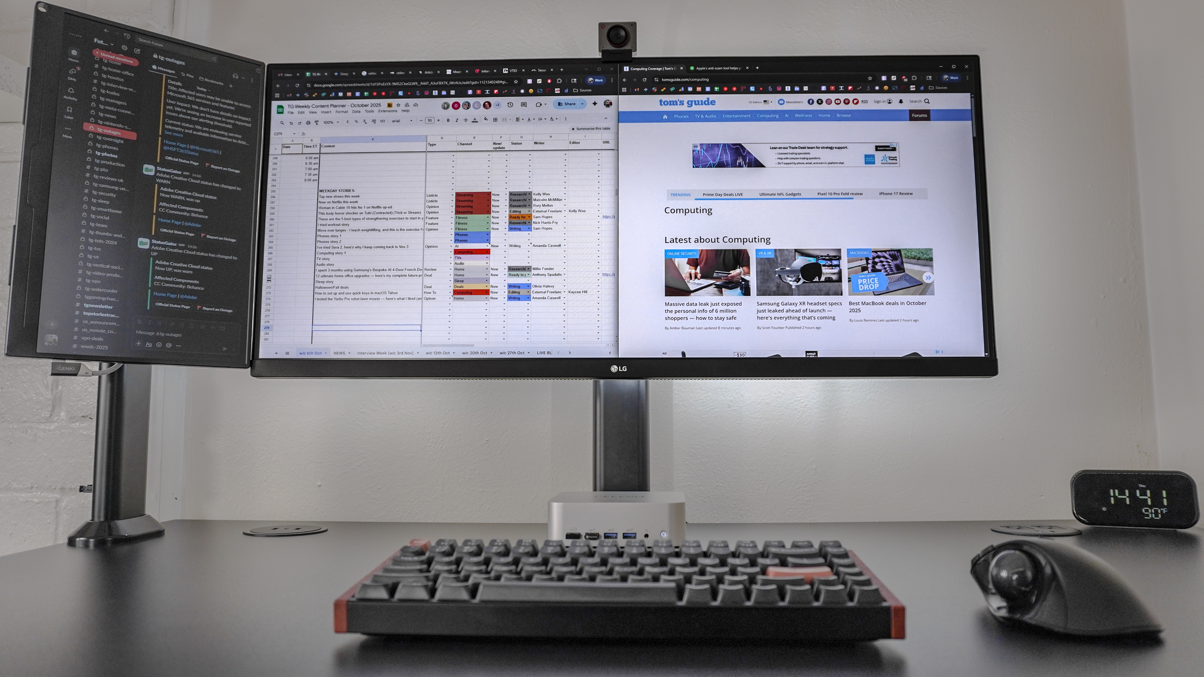 A portable monitor mounted next to an ultrawide display with a work chat app open on the smaller screen