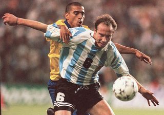 Argentina's Roberto Sensini competes for the ball with Colombia's Victor Aristizabal in a World Cup qualifier in November 1997.