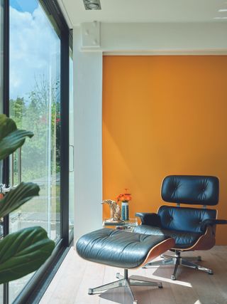 Yellow room with vintage leather chair