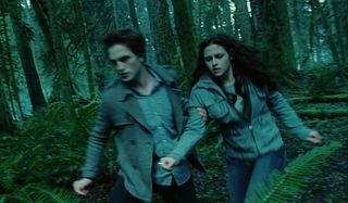 Robert Pattinson and Kristen Stewart in forest in Twilight