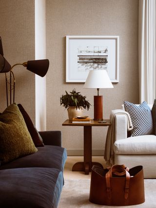 Neutral living room with blue velvet sofa