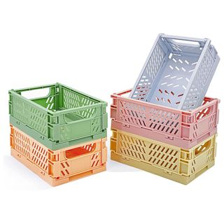 Five pastel plastic crates