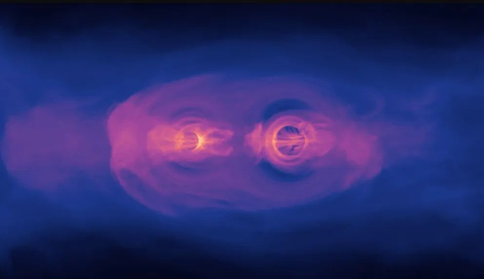 NASA simulation shows the glow from two supermassive black holes as they spiral toward each other ahead of a collision