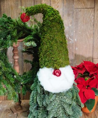 Christmas tree with beard and hat made from moss