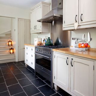 kitchen with cream cabinets and gas cookpot