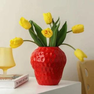 Strawberry vase red with bright yellow tulips 