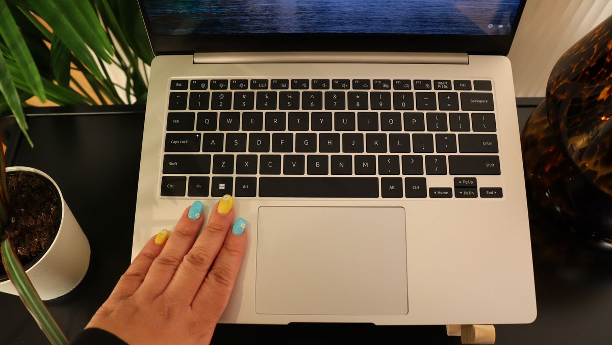 closeup of Samsung Galaxy Book3 with hand