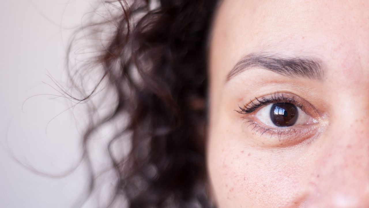 A closeup of a woman&amp;#039;s face, highlighting one eye.