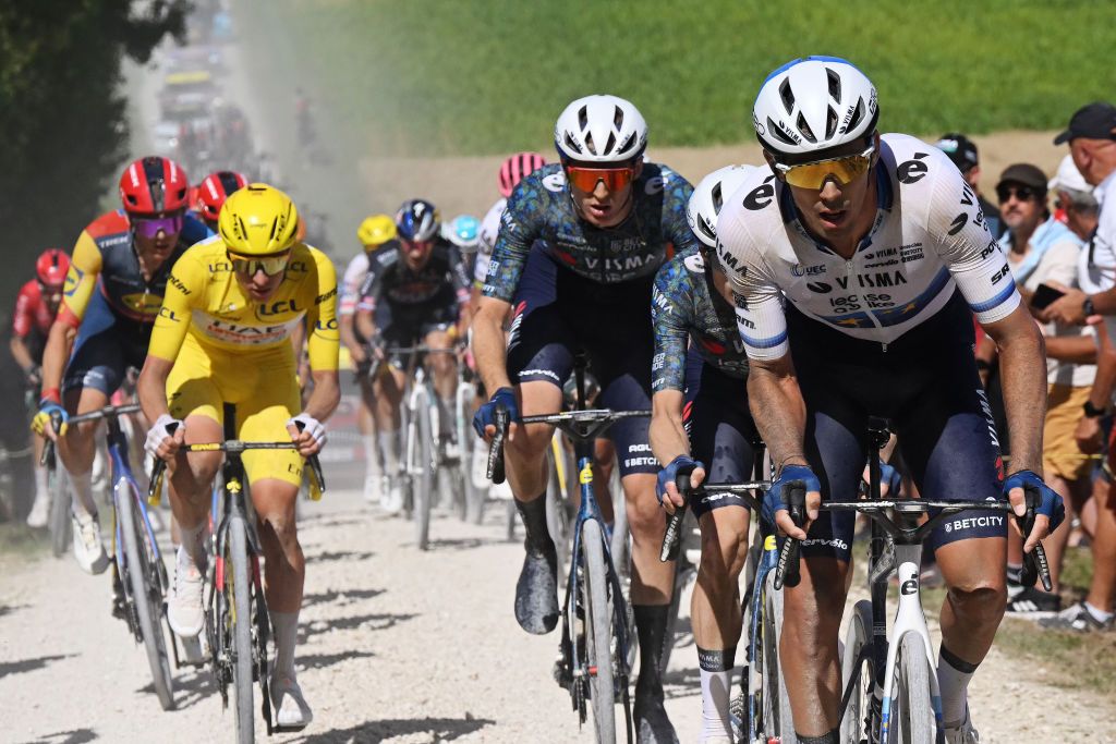 TROYES FRANCE JULY 07 LR Tadej Pogacar of Slovenia and UAE Team Emirates Yellow Leader Jersey Matteo Jorgenson of The United States Christophe Laporte of France and Team Visma Lease a Bike compete passing through a gravel strokes sector during the 111th Tour de France 2024 Stage 9 a 199km stage from Troyes to Troyes UCIWT on July 07 2024 in Troyes France Photo by Bernard Papon PoolGetty Images