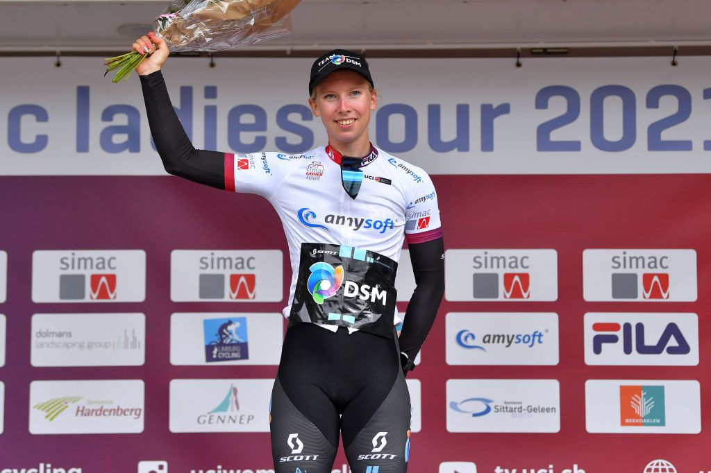 HARDENBERG NETHERLANDS AUGUST 25 Lorena Wiebes of Netherlands and Team DSM celebrates winning the White Best Young Rider Jersey on the podium ceremony after the 23rd Simac Ladies Tour 2021 Stage 1 a 1344km stage from Zwolle to Hardenberg SLT2021 UCIWWT on August 25 2021 in Hardenberg Netherlands Photo by Luc ClaessenGetty Images