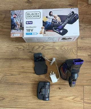 Black+Decker dustbuster furbuster AdvanceClean+ Pet handheld vacuum parts, attachments and original packaging on wooden floor (1)