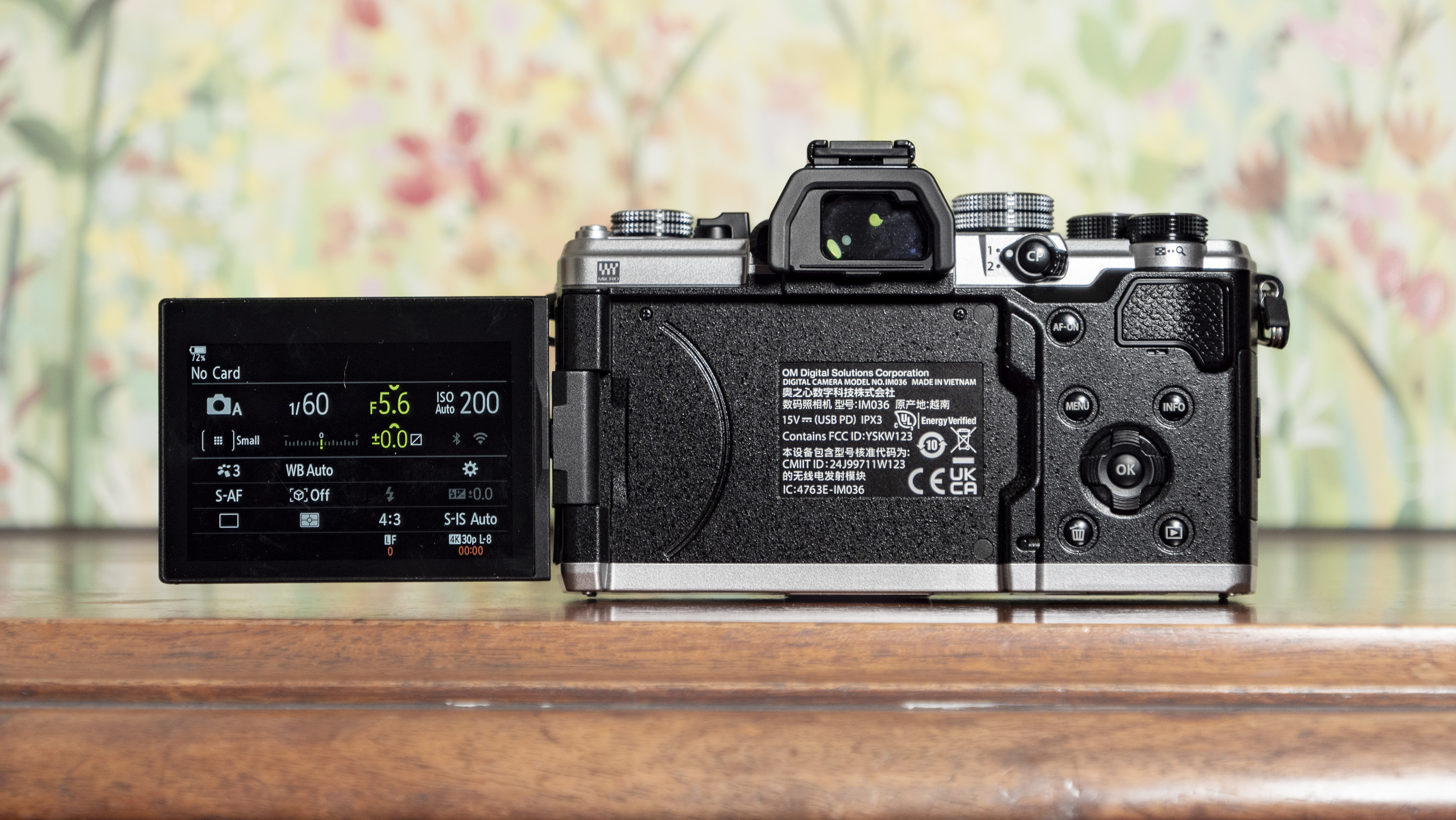 Rear of the OM System OM-3 mirrorless camera with touchscreen flipped out